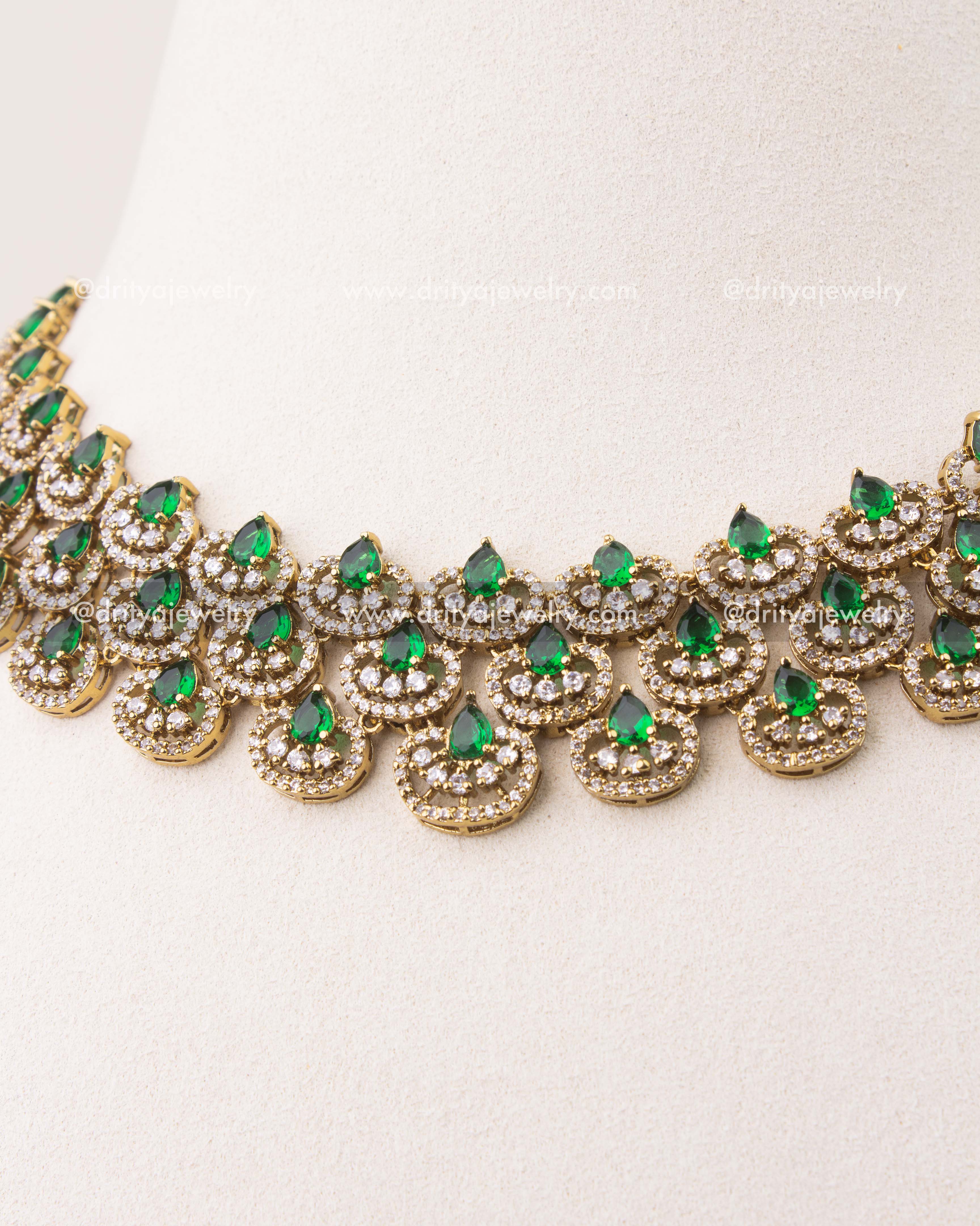 Close-up of Victorian short necklace featuring emerald green teardrop stones and CZ detailing