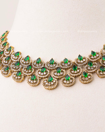 Close-up of Victorian short necklace featuring emerald green teardrop stones and CZ detailing
