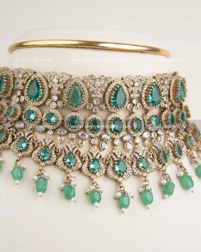 Close-up view of Russian emerald stones, teardrop motifs, and intricate Victorian filigree craftsmanship.