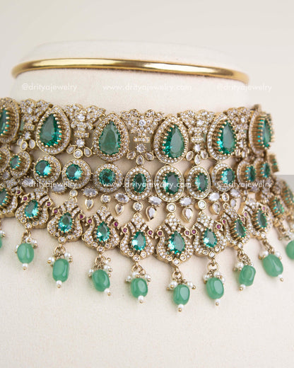 Close-up view of Russian emerald stones, teardrop motifs, and intricate Victorian filigree craftsmanship.