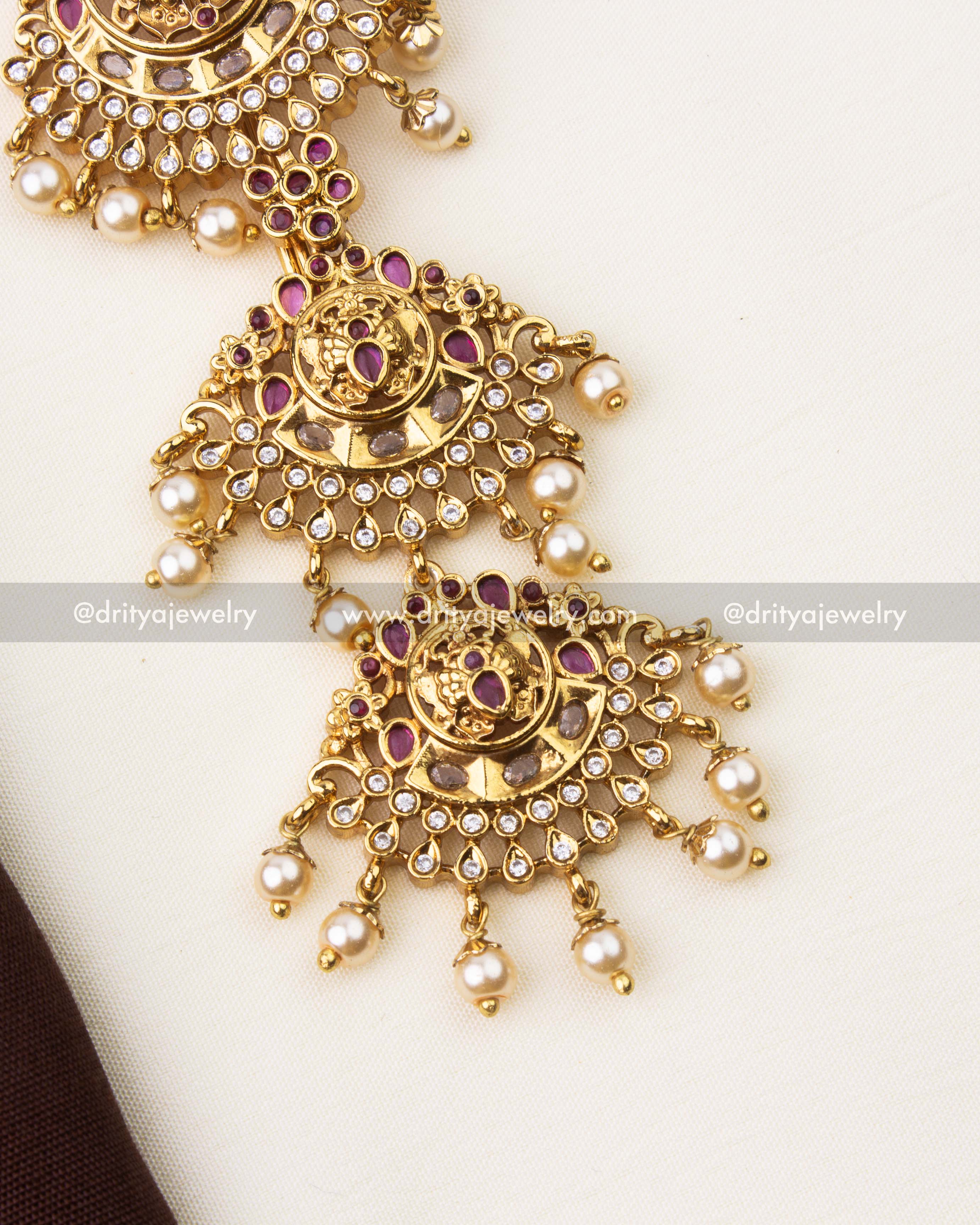 Traditional South Indian long jada billa in ruby red stones with antique gold polish and intricate detailing