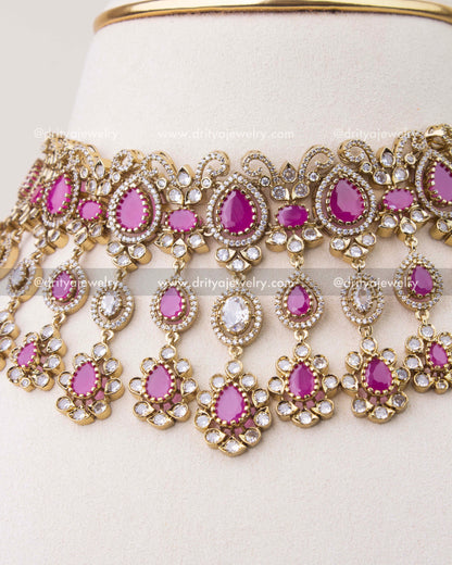 Close-up of ruby pink Victorian choker with intricate CZ stone work and hanging motifs
