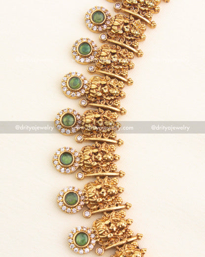 Close-up of green stone temple choker with Lakshmi carvings
