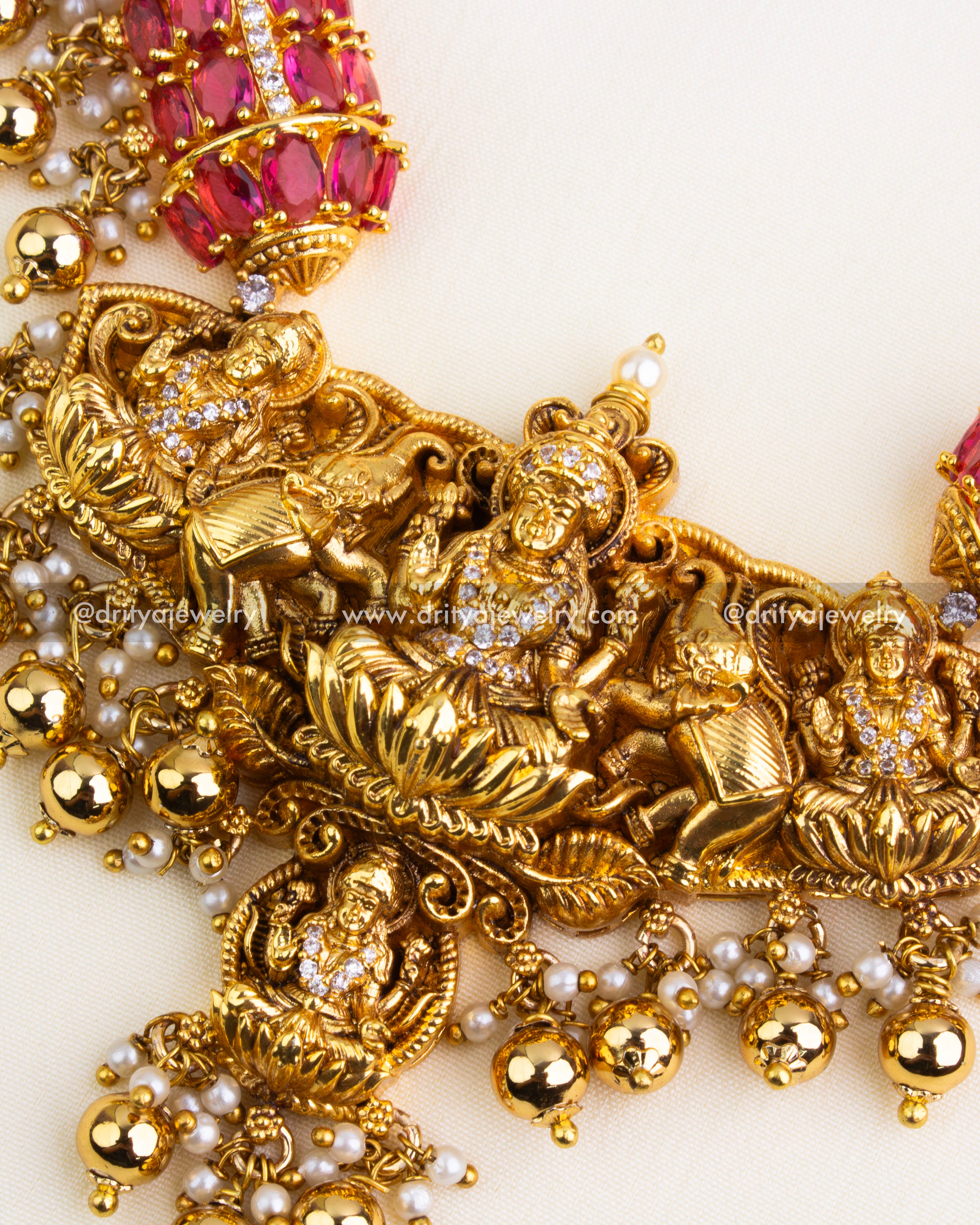 Temple motifs with ruby stones and elephant detailing