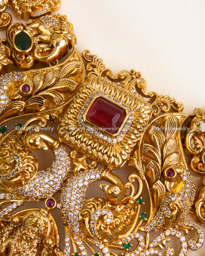Highlight of ruby centerpiece and surrounding intricate nakshi patterns.