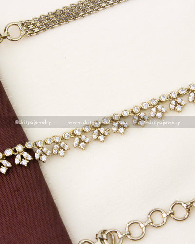Close-up of Victorian style hip chain with cubic zirconia stones and floral motifs