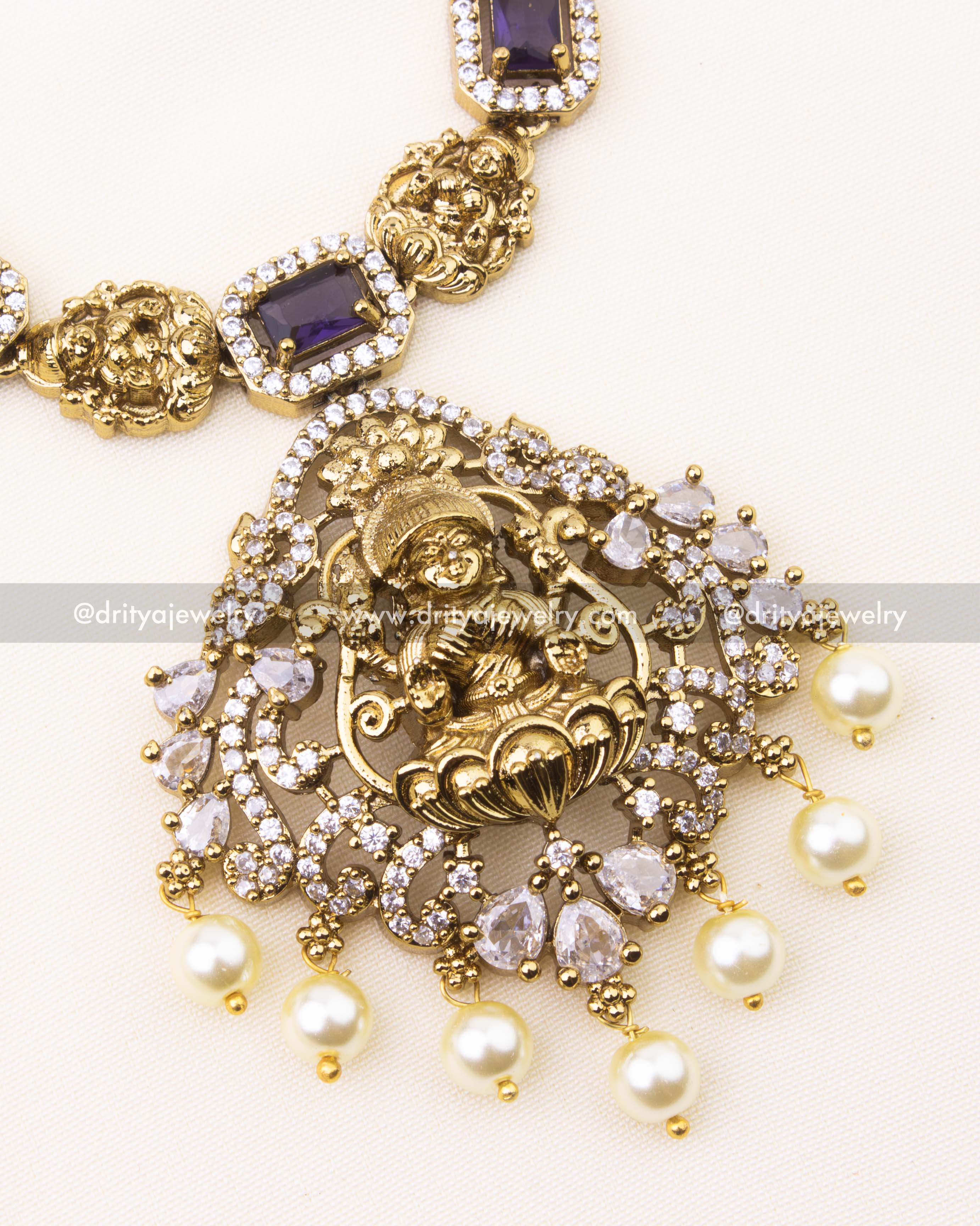 Zoomed view of purple temple necklace with CZ work and pearl details