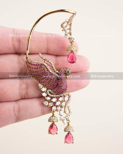 Detailed close-up of Victorian ear cuffs showing CZ stones, feather design, and pink teardrop drops.