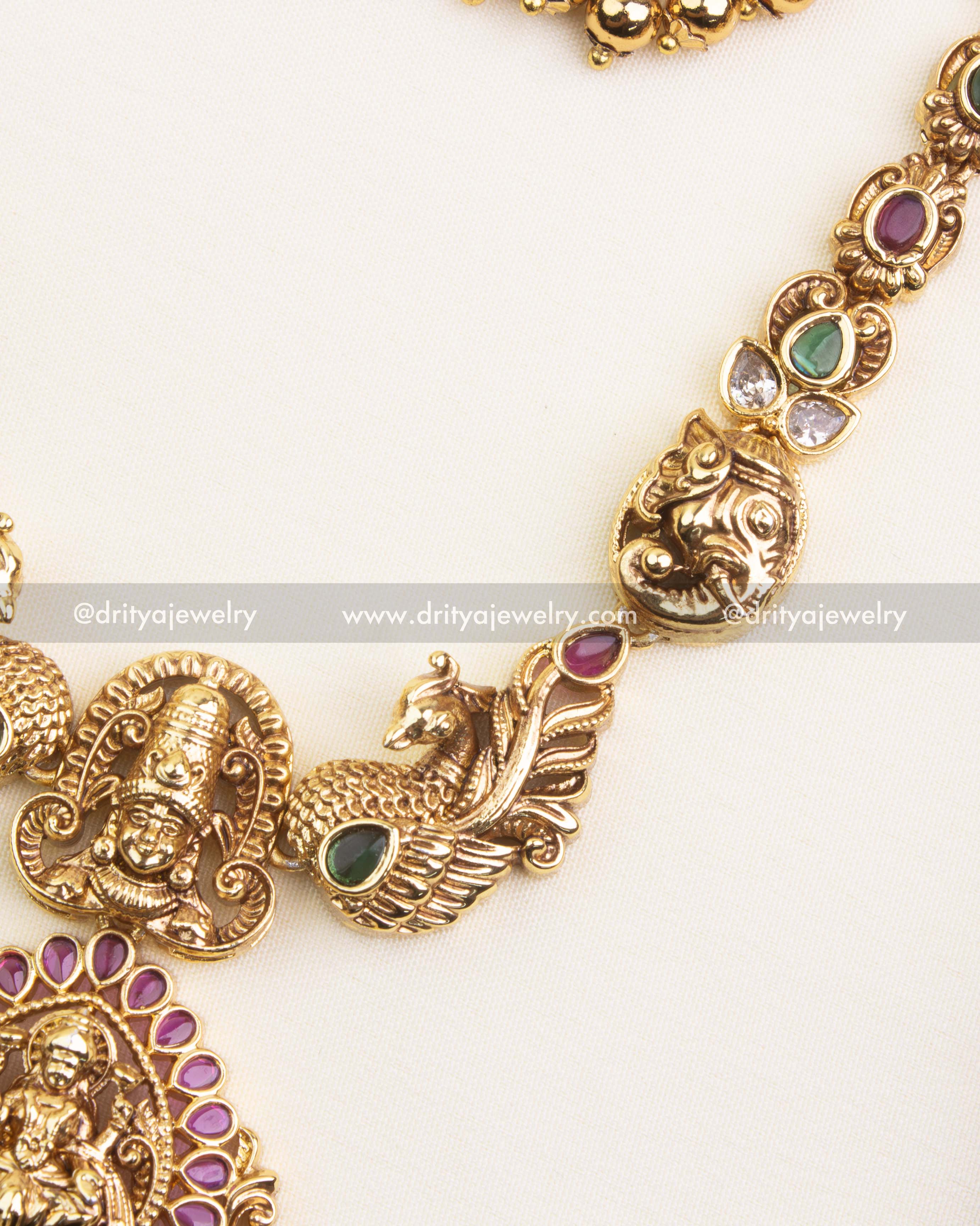 Detailed peacock and yali motifs with ruby and emerald accents on temple necklace