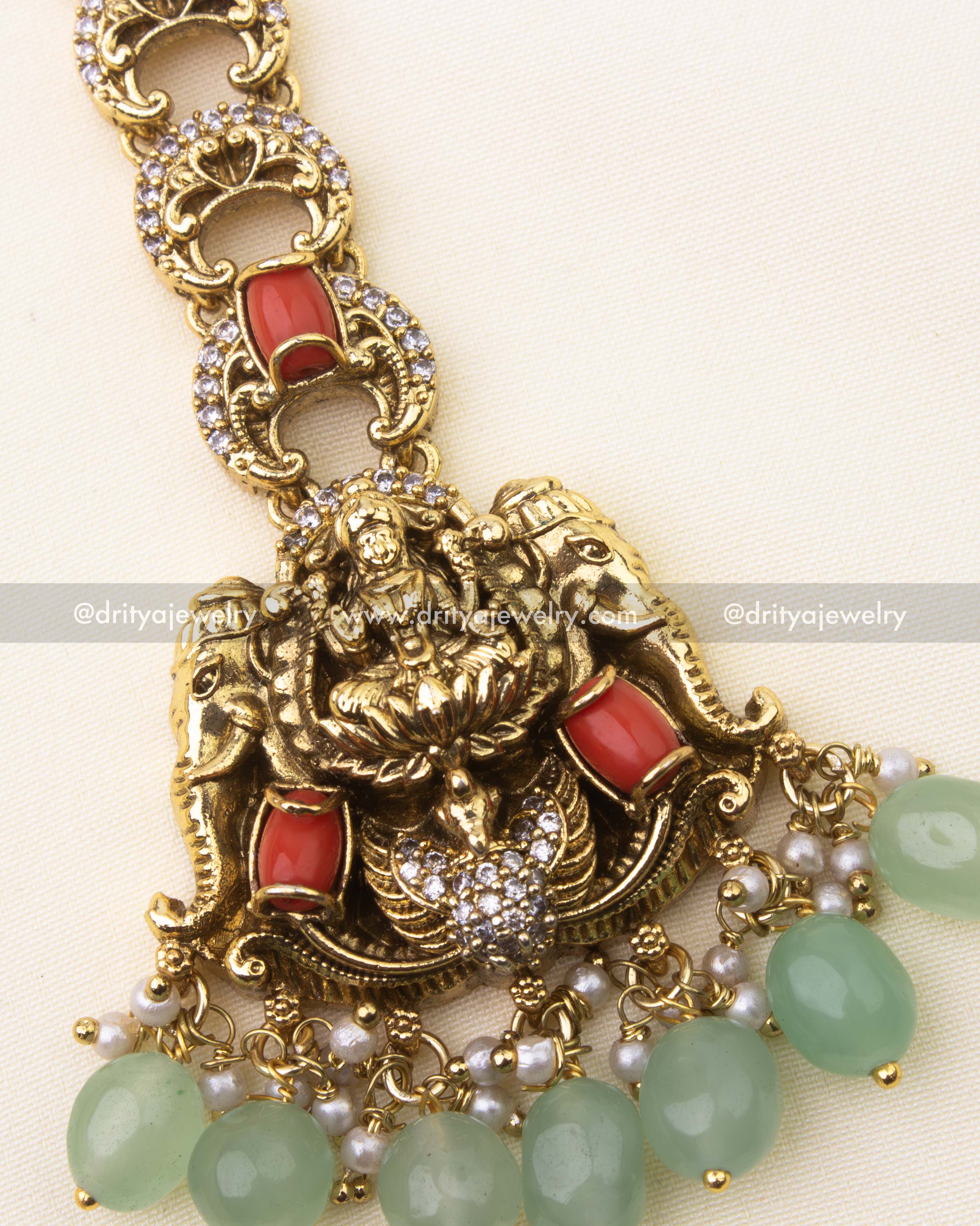 Coral stones with mint green beads and divine Lakshmi motif