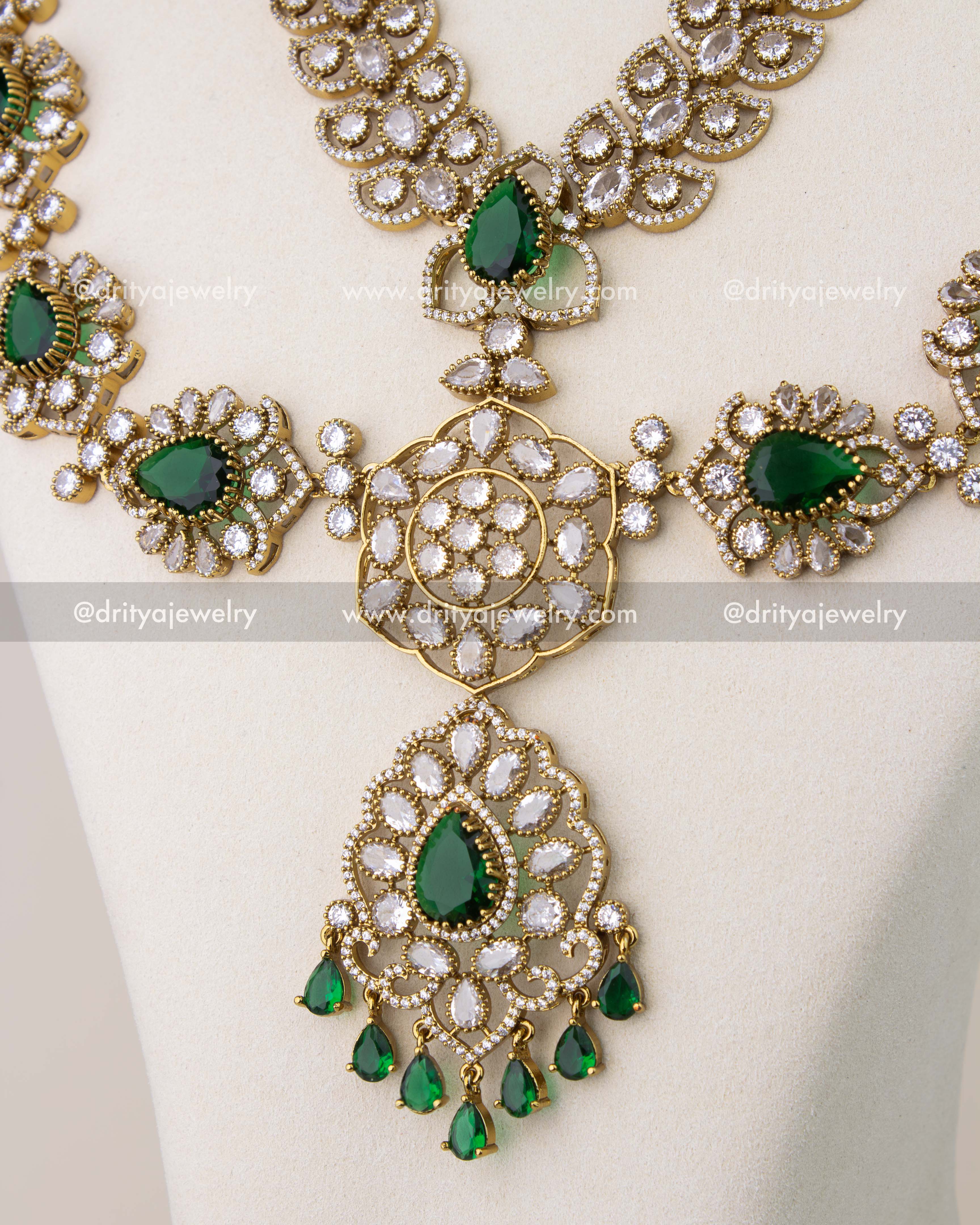 Close-up of emerald green stone pendant with crystal detailing in Victorian bridal necklace