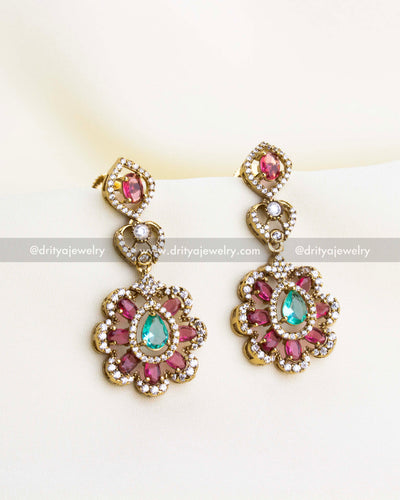 SKU 1135 - Necklace Set - Close-up front view of emerald and pink stone drop earrings