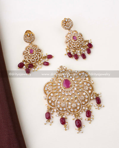 1269-R necklace pendant with matching red stone earrings laid flat