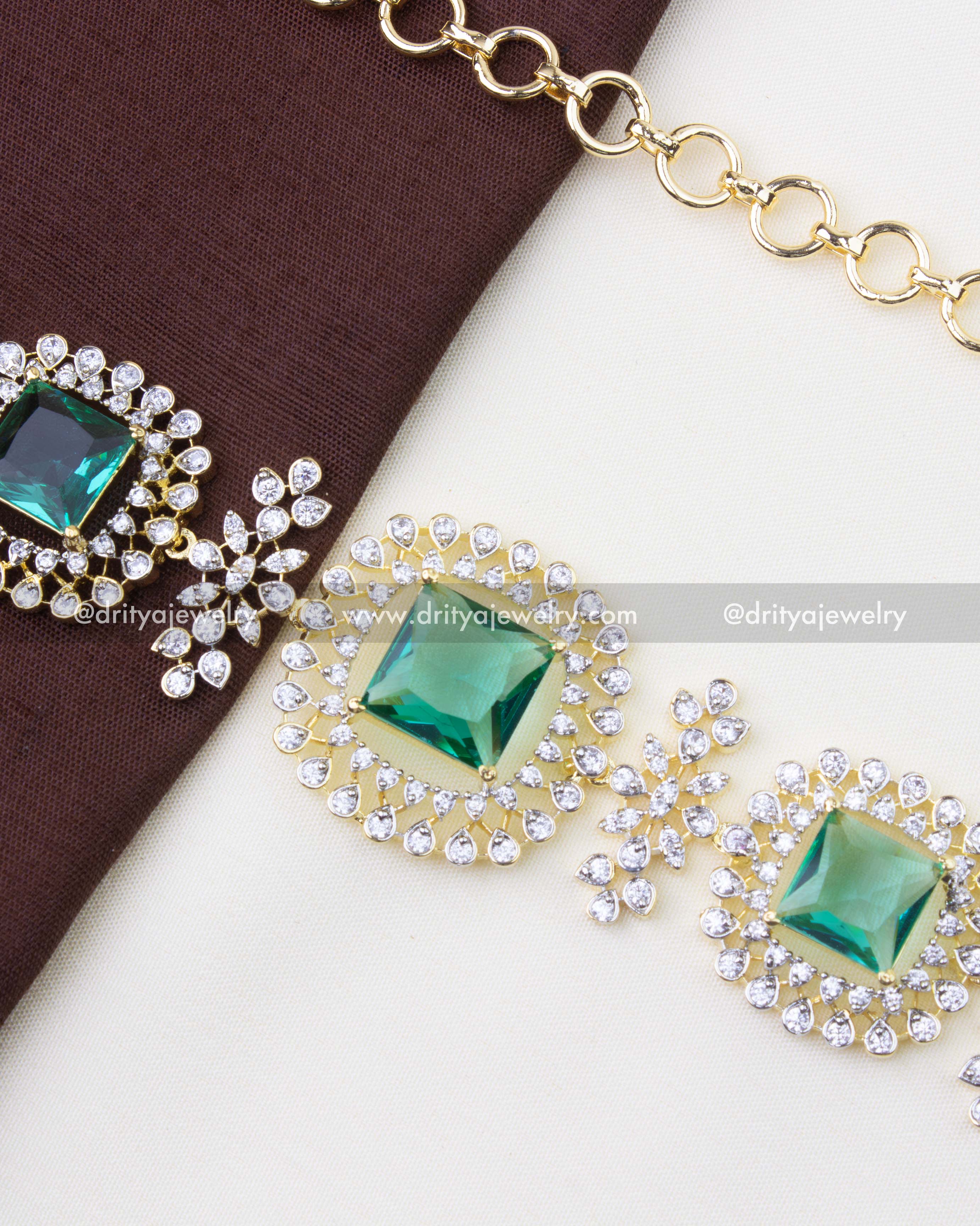 1228-MG close-up of emerald and CZ motifs on dual-tone replica waist chain