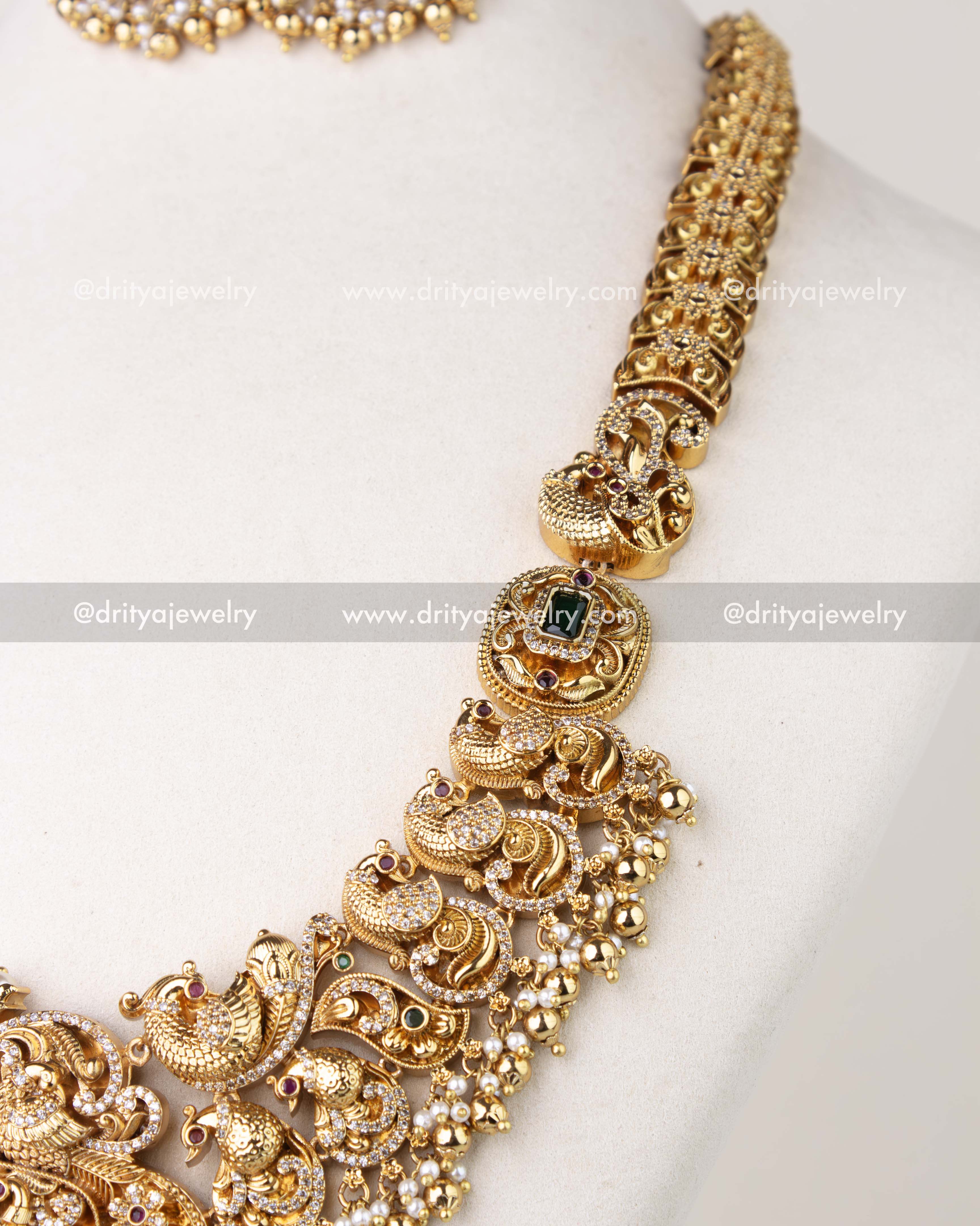 1310 - Close-up of sculpted bird motifs and pearl-like fringe on bridal long haram necklace