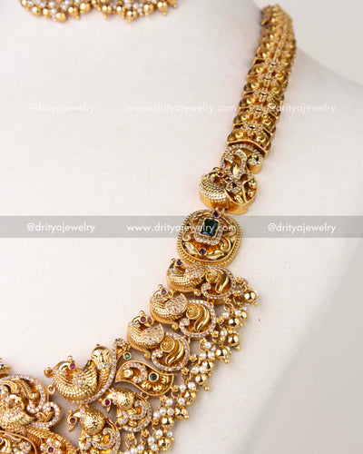 1310 - Close-up of sculpted bird motifs and pearl-like fringe on bridal long haram necklace