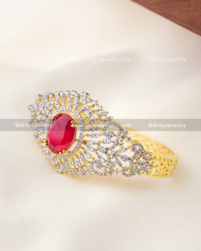 1295-R kada angled view highlighting red center stone and sparkling stones