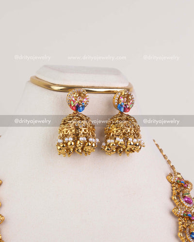 SKU 1246 - Long Srinivasa Kalyanam necklace set jhumka earrings close-up view