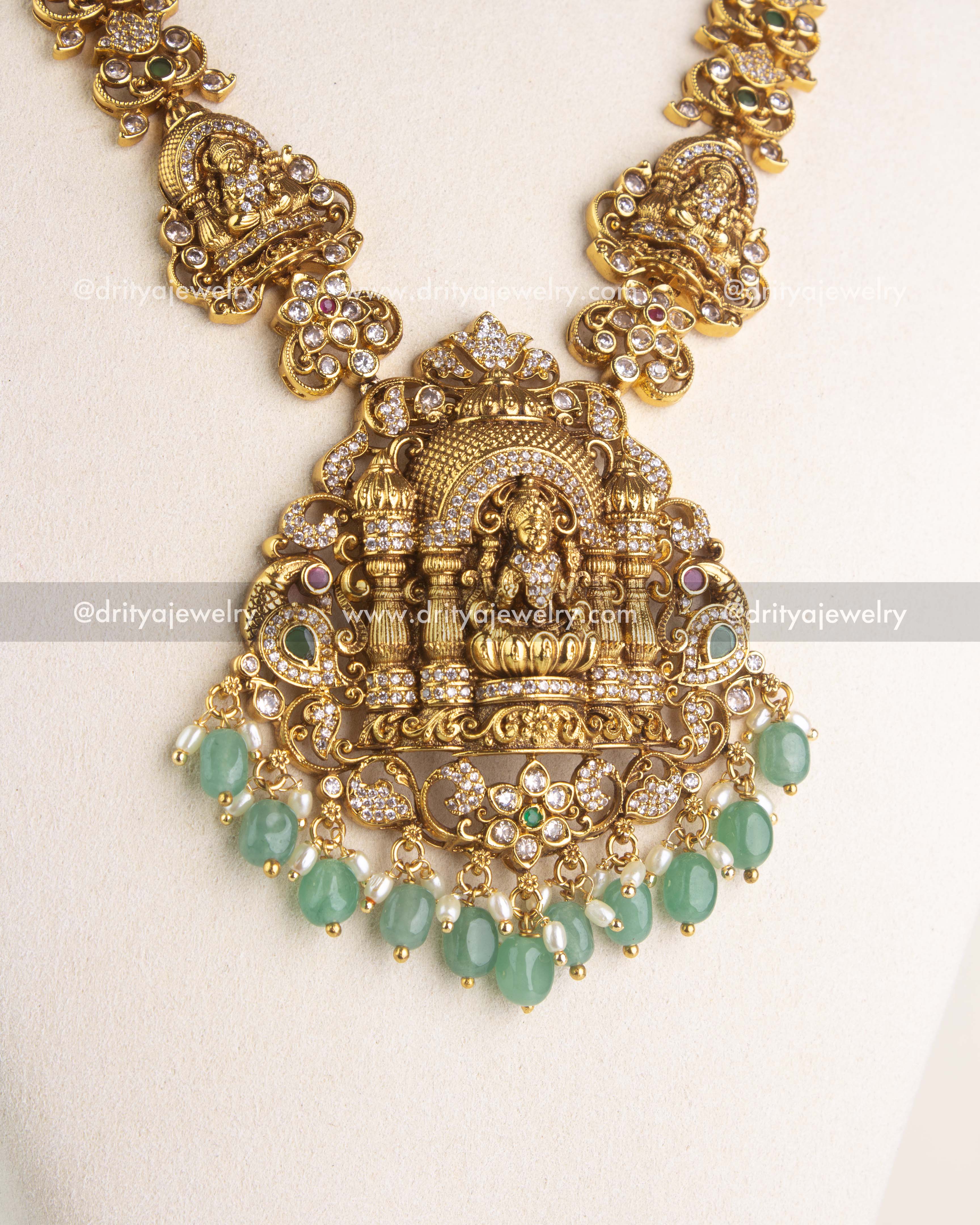 SKU 1169 close-up of temple-style god idol pendant with mint bead and pearl-like drops