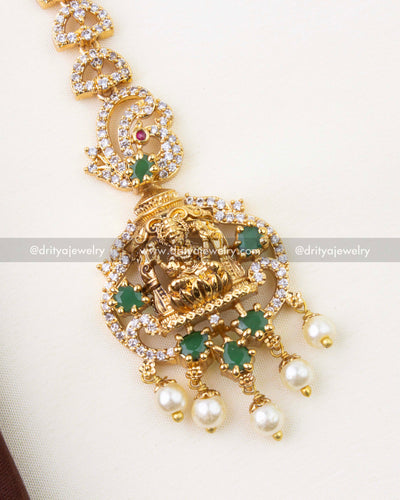1297-G close-up of nakshi temple god idol maang tikka with emerald green detailing