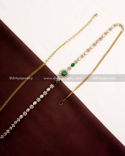 1109-G Victorian emerald CZ hip chain full length view on fabric backdrop