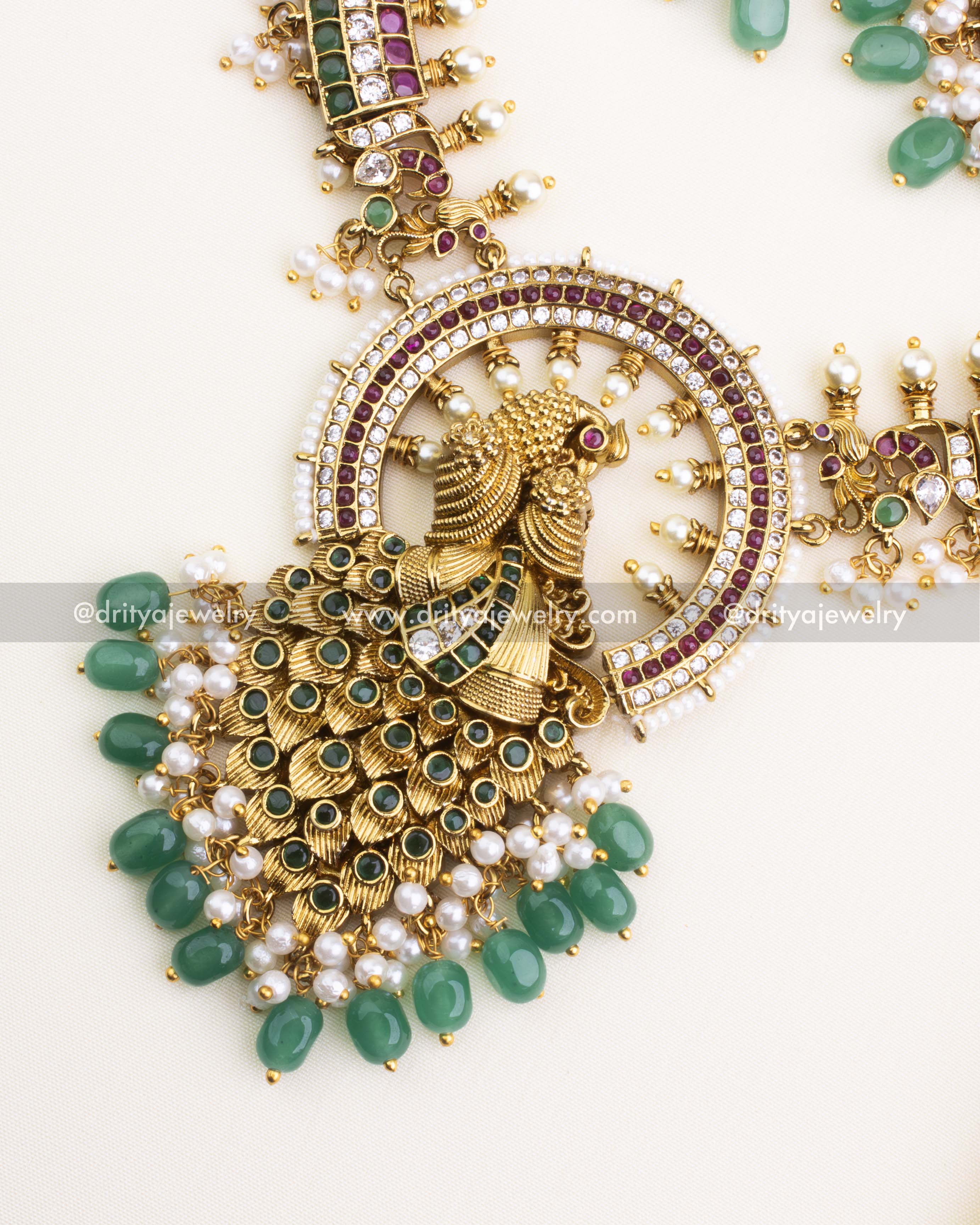 SKU 1108 Necklace Set - Close-up of idol-style peacock pendant with green bead drops