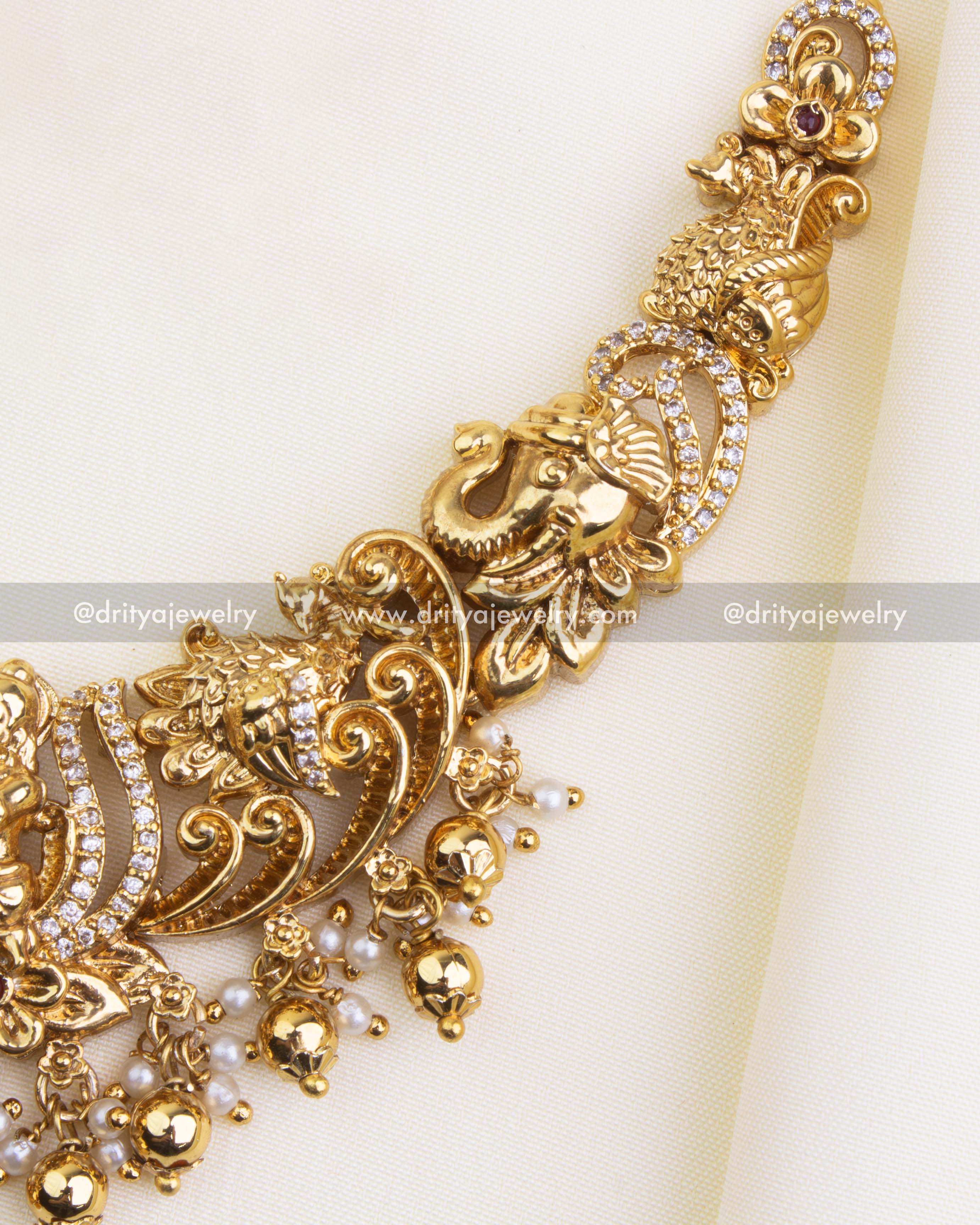 SKU 1121 Necklace Set - Close-up of necklace side showing elephant and floral motifs with bead drops