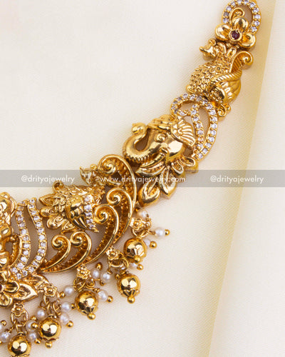 SKU 1121 Necklace Set - Close-up of necklace side showing elephant and floral motifs with bead drops