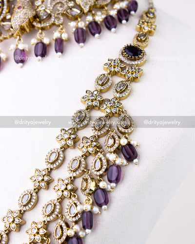 1309-PUSET angled view of layered necklace links showing floral and teardrop CZ work