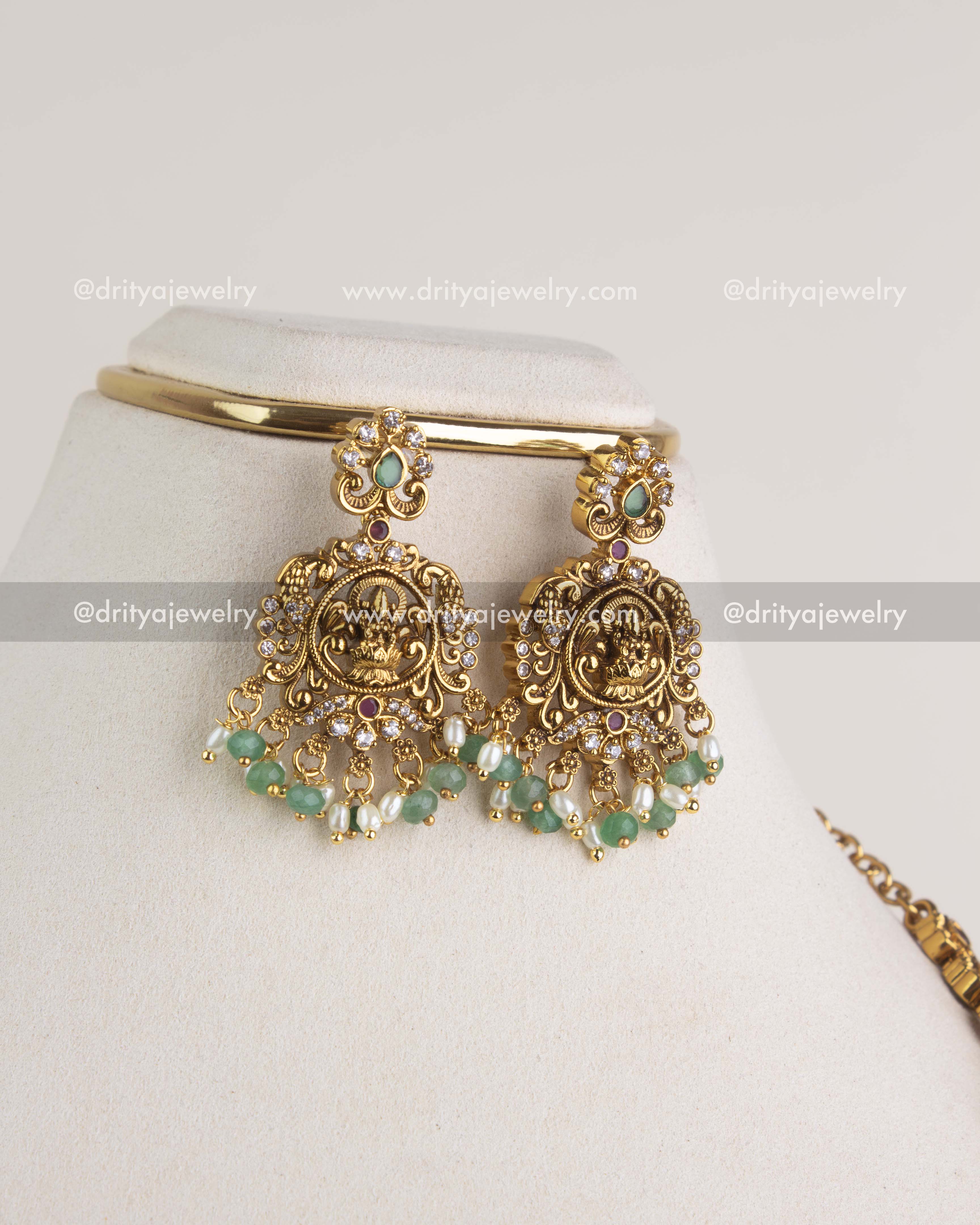 SKU 1186 Necklace Set close-up of matching god idol earrings with green and pearl-like bead drops