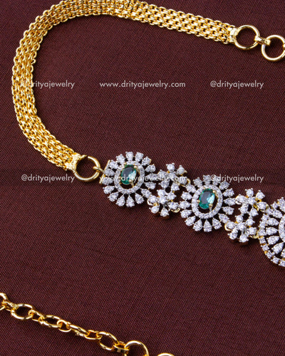 1291-RE hip chain showing central emerald CZ panel and gold-toned side chains