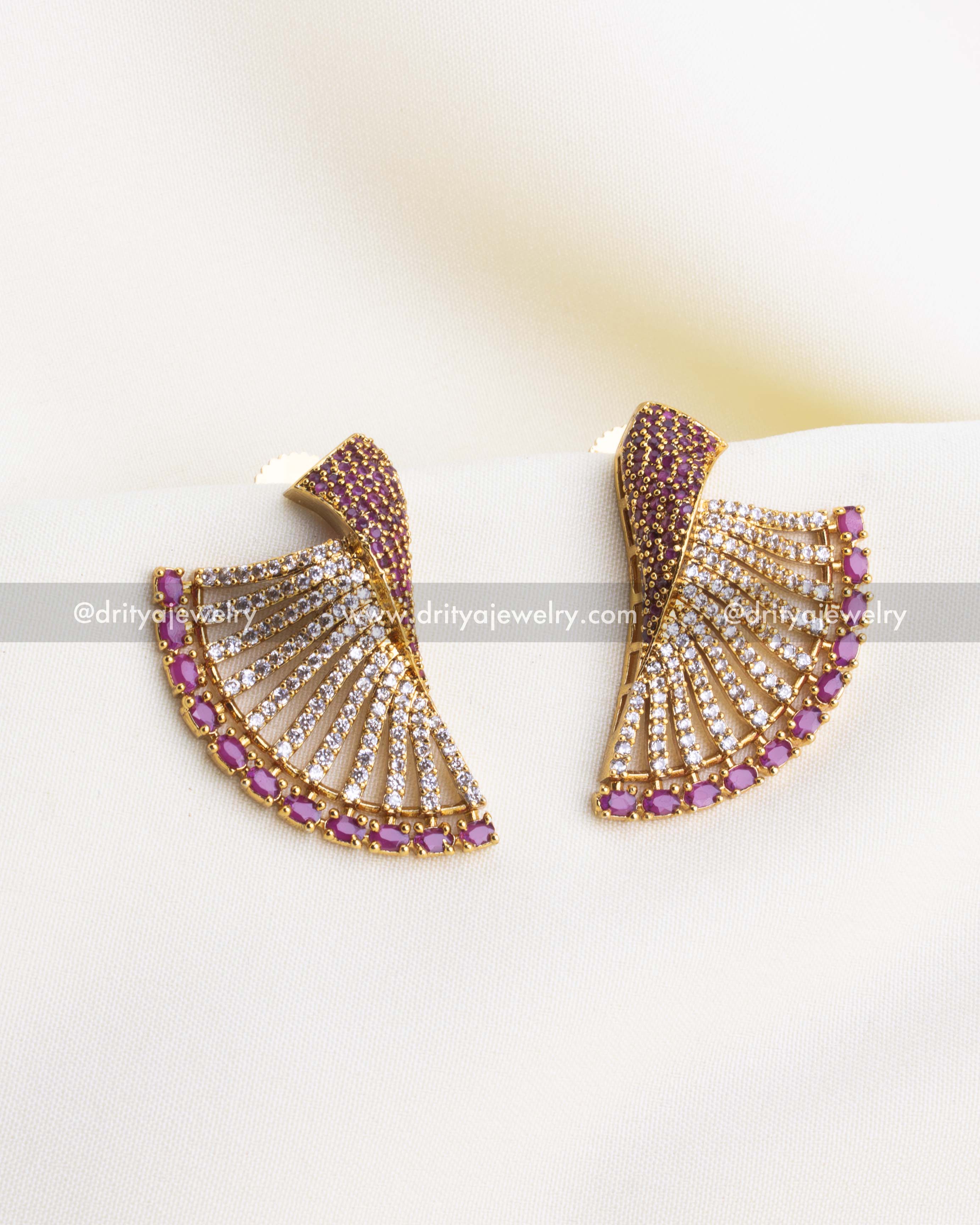 1119-P - Earrings - Front view of gold-toned fan-shaped earrings with CZ and ruby stones