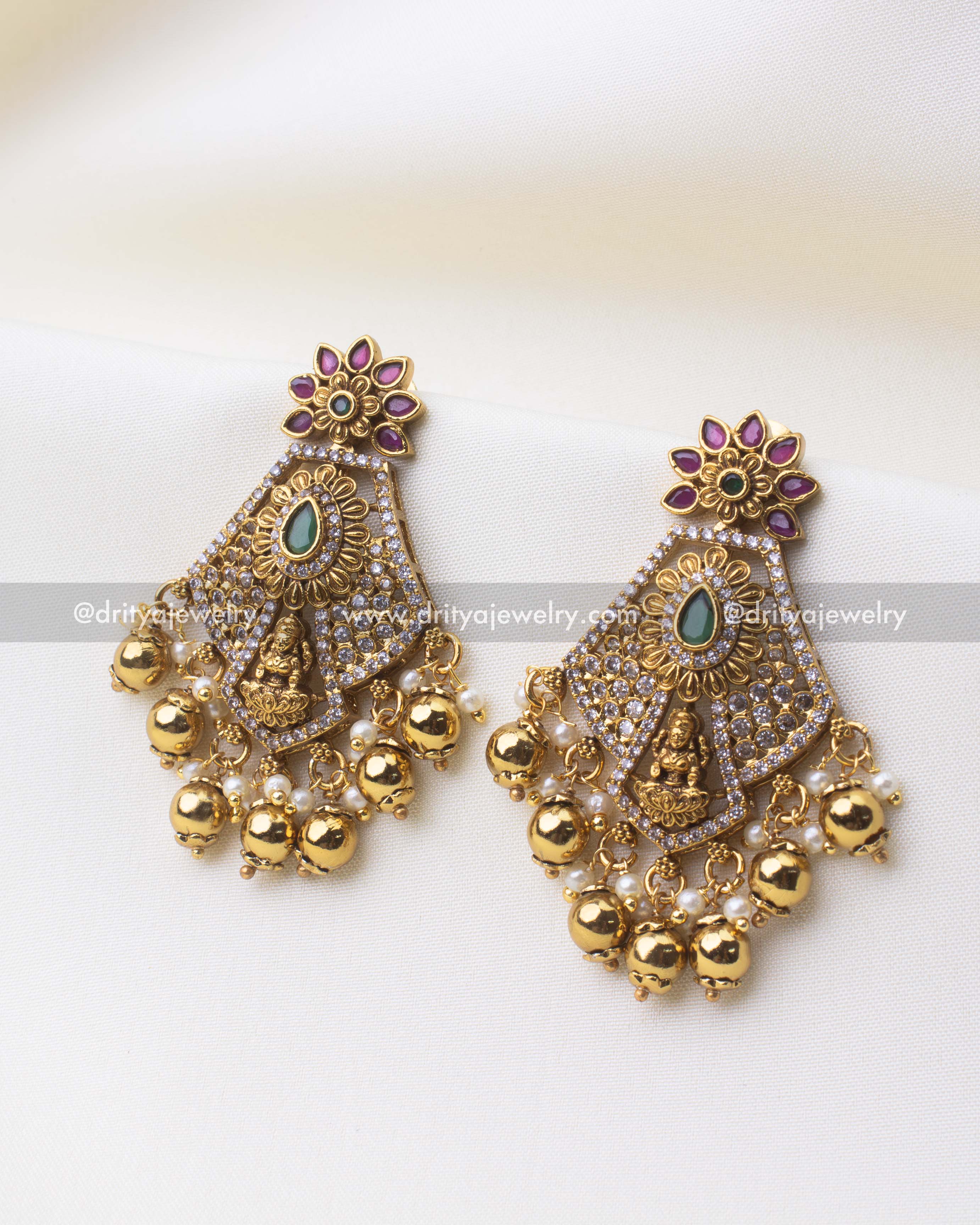 SKU 1252 - Temple dangler earrings front view with god idol motif and ghungroo drops