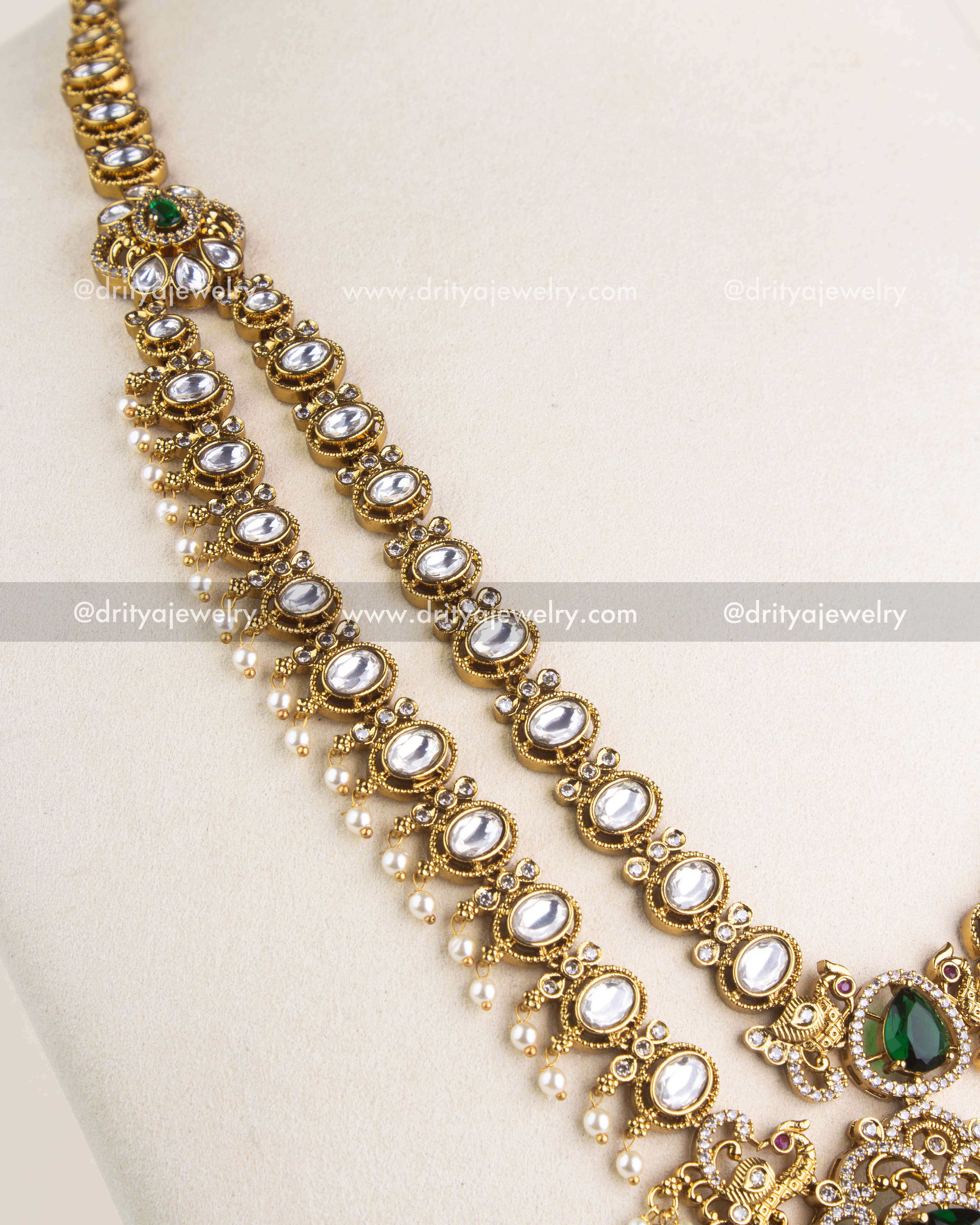 Close-up of layered kundan long necklace strands with pearl drops and green stone accent, SKU 1156-G - Necklace Set - Side View