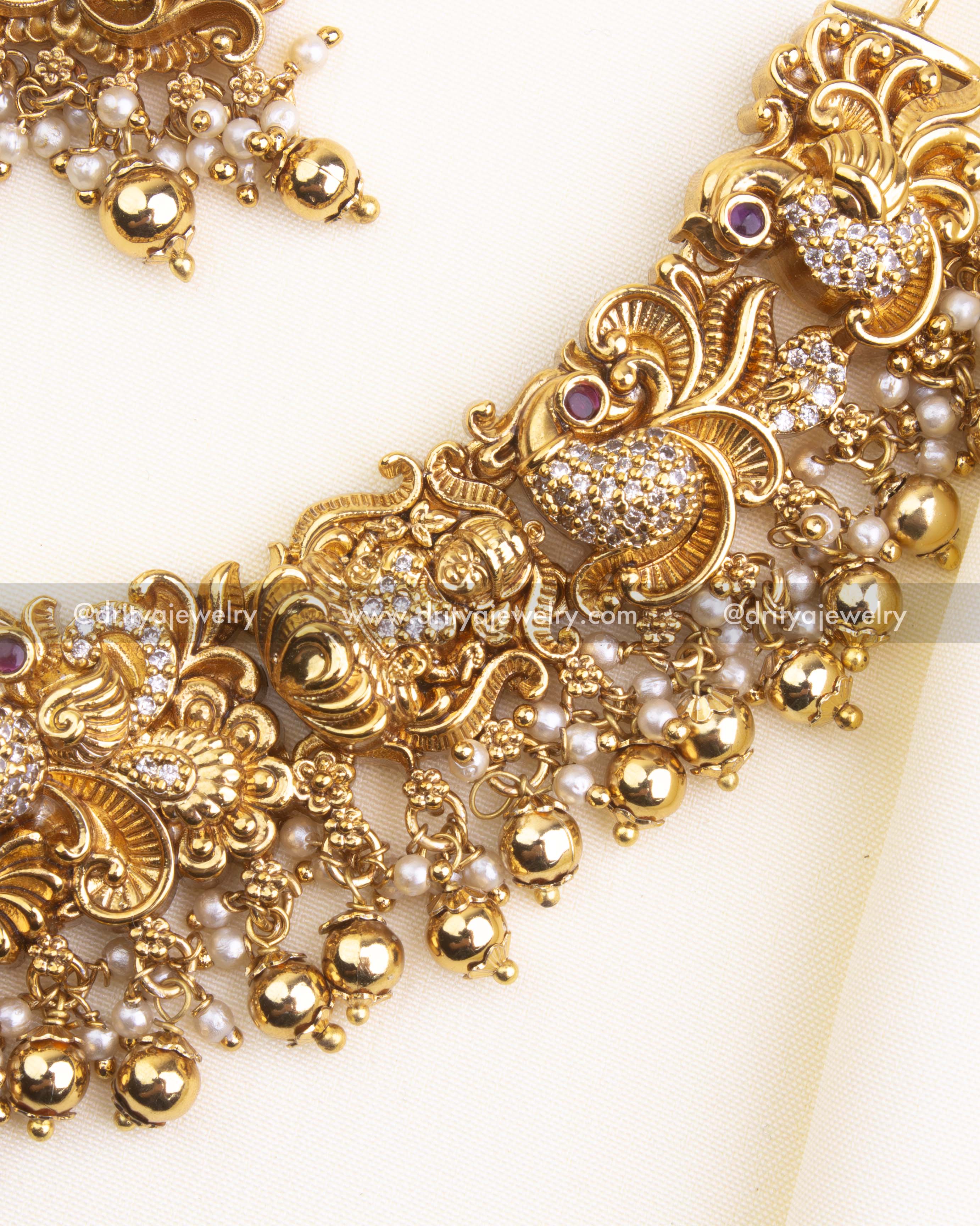 700-GGO - Necklace Set - Side close-up of necklace edge with nakshi work and bead tassels