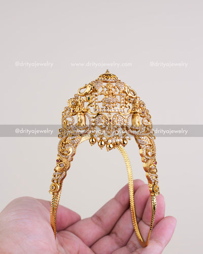 1126 - Front view of gold-toned temple vanki with god idol and stone work