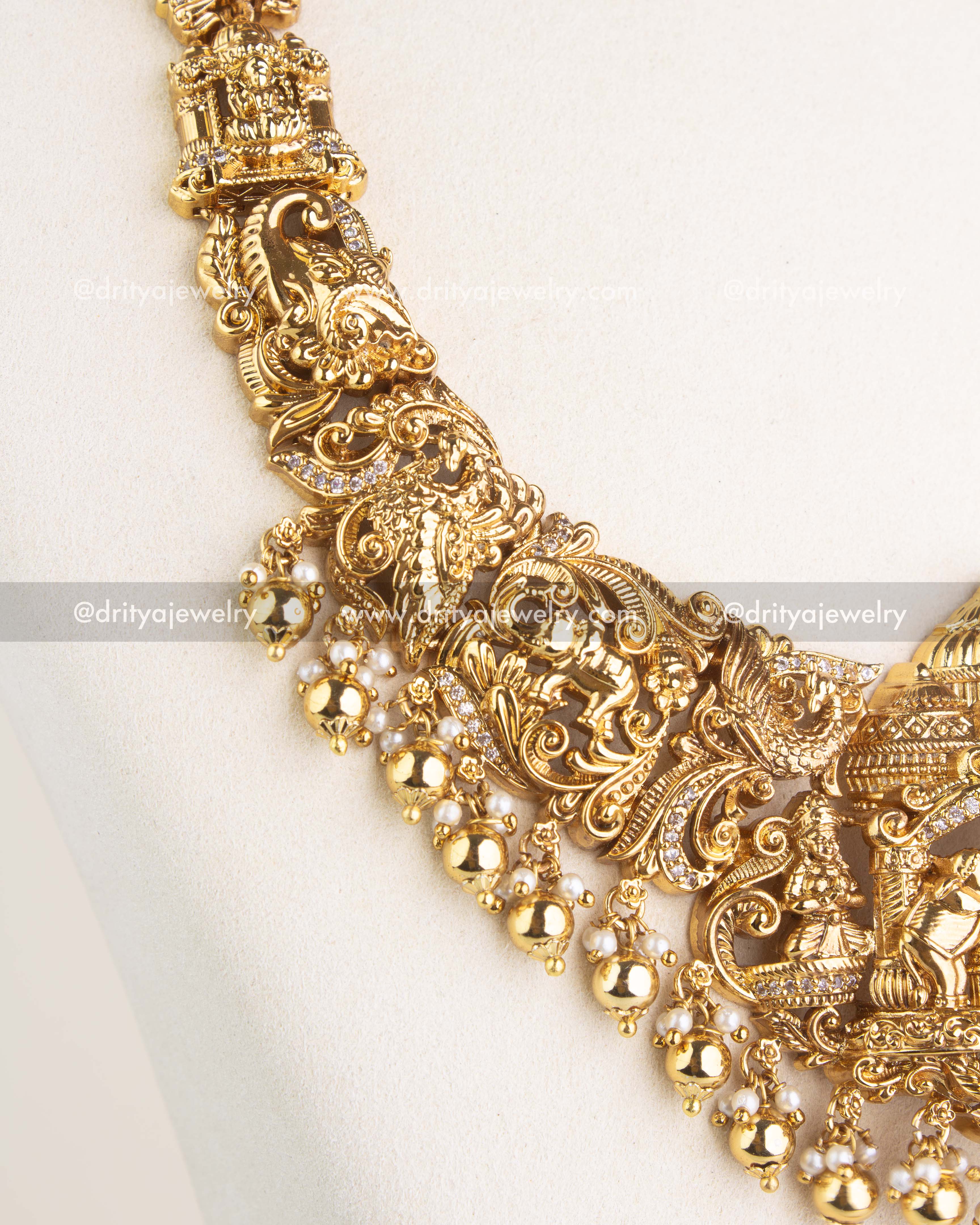 SKU 1124 - Necklace Set - Close-up of sculpted mythological figures and pearl-like drops along necklace edge.