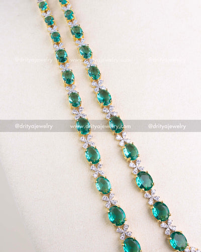 1215-RE long strands of oval emerald replica stones with CZ links in gold-toned setting