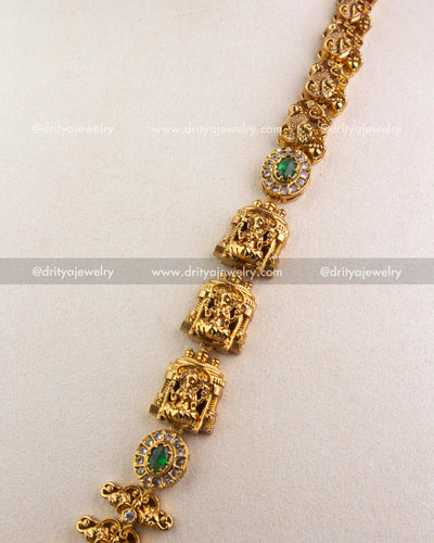 1240-G side view of temple long necklace showing repeating deity panels and green stone settings