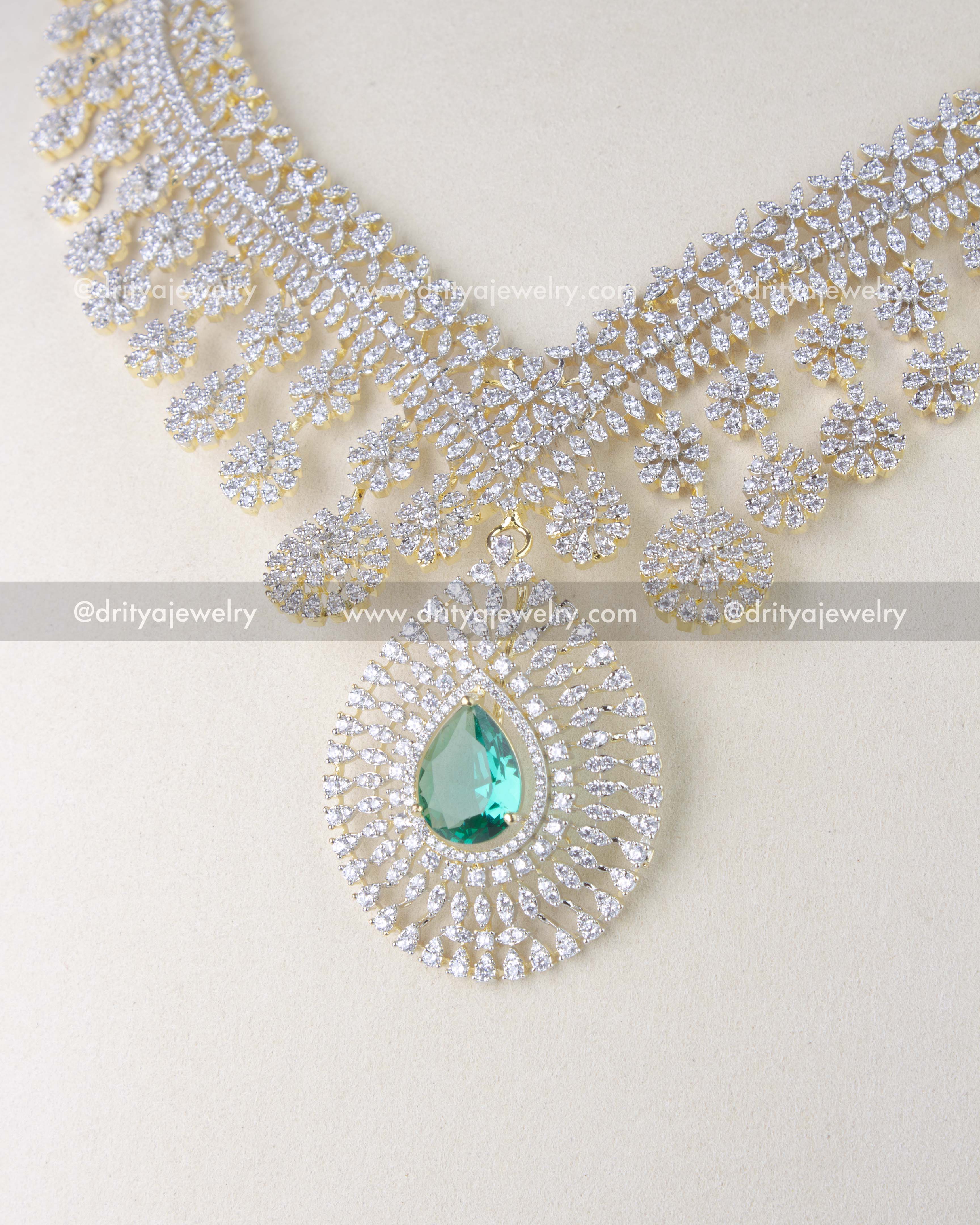 1214-RE close-up of emerald pendant on CZ long necklace