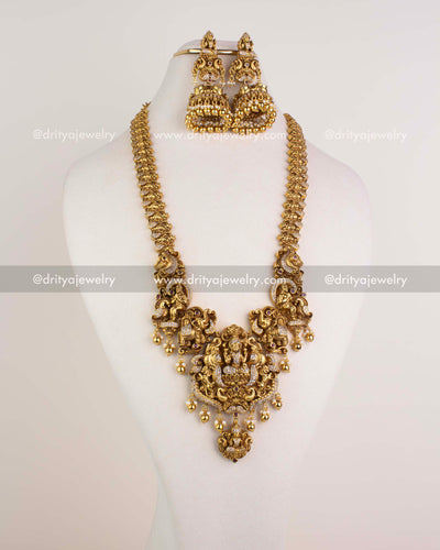1253 - Temple long necklace set with god idol pendant and big jhumka earrings front view