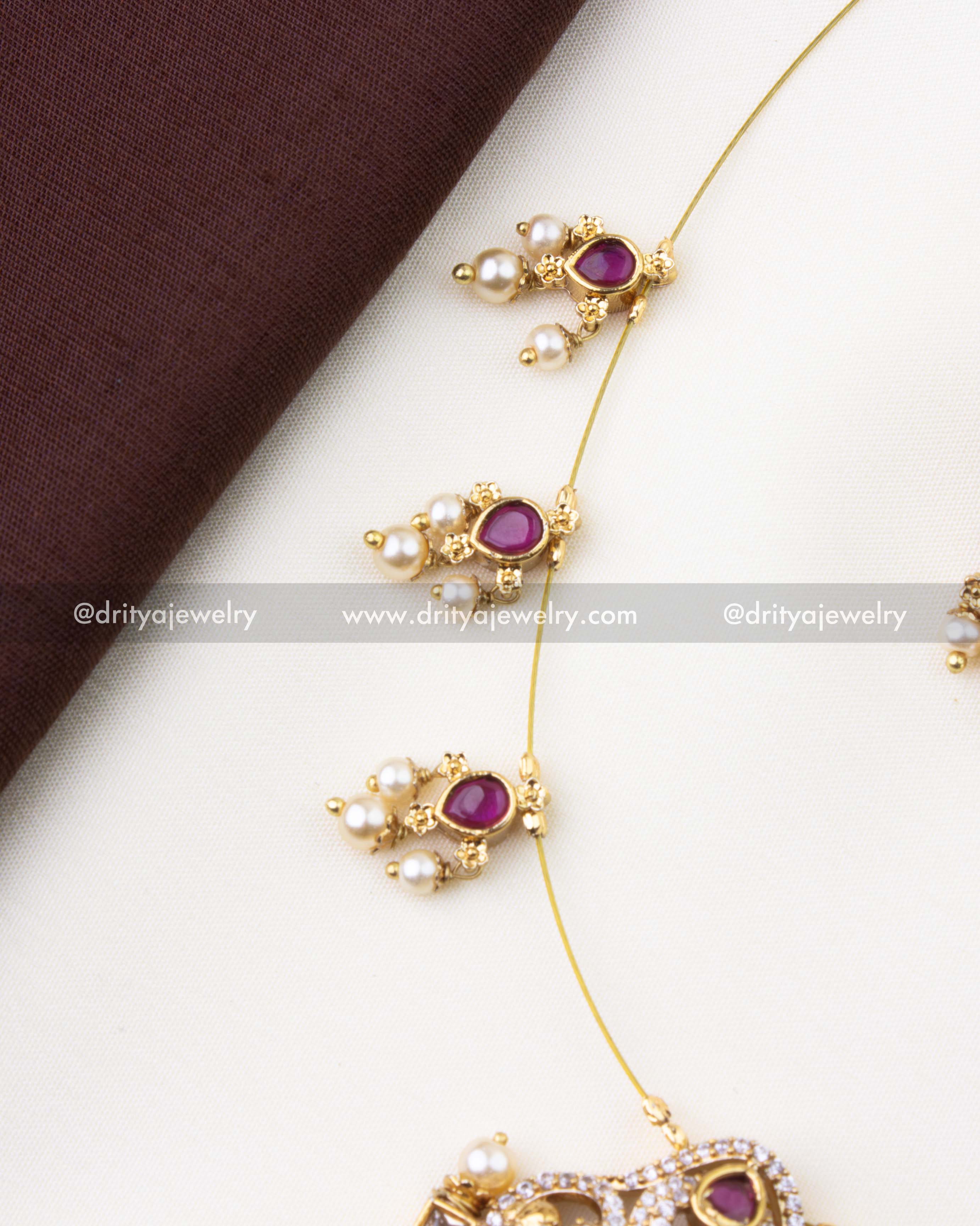 1216-R invisible chain detail with ruby red and pearl clusters on temple necklace