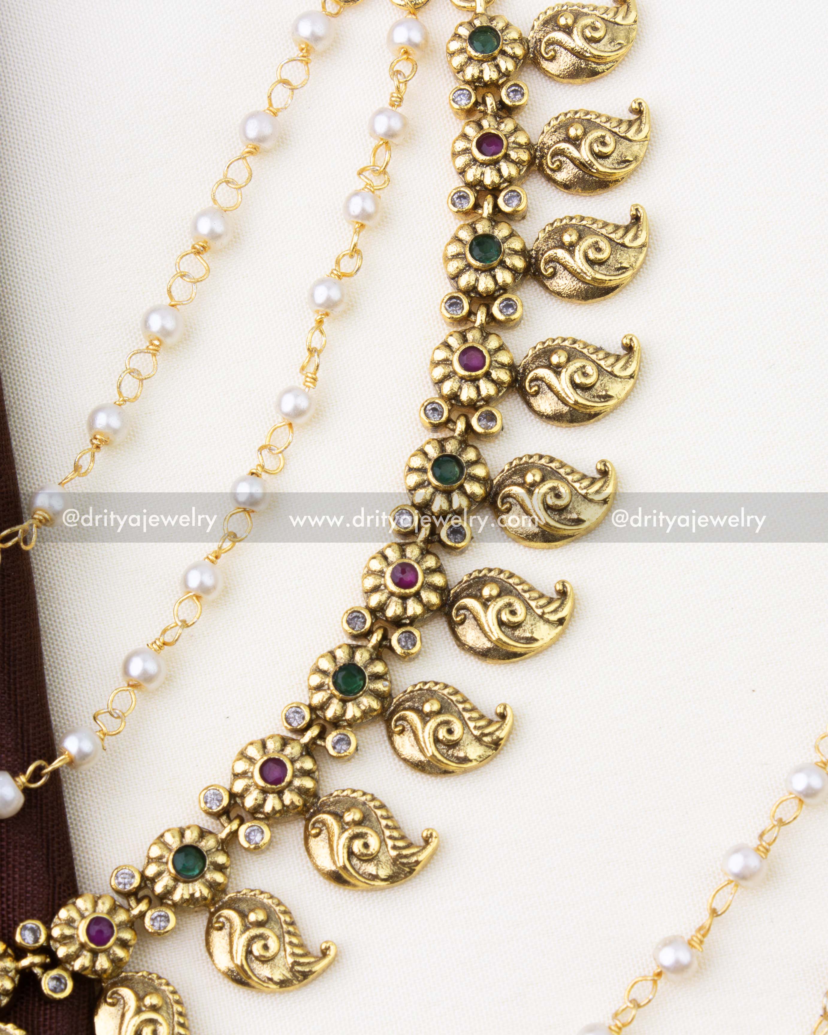 SKU 1294 antique finish mango champaswaralu showing ruby and emerald floral motifs