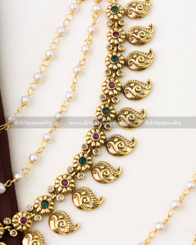 SKU 1294 antique finish mango champaswaralu showing ruby and emerald floral motifs