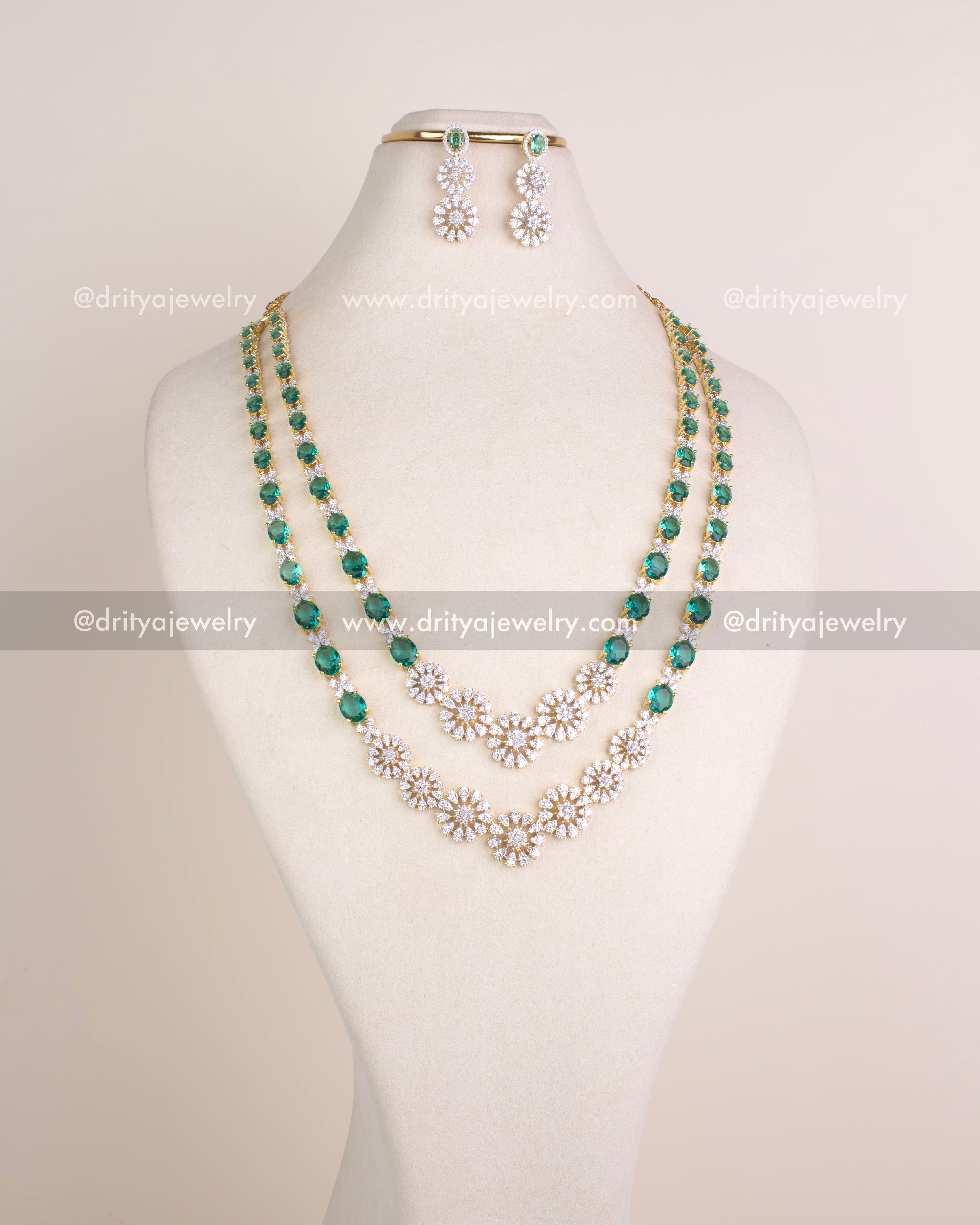 1215-RE layered emerald and CZ bridal necklace set with matching dangler earrings displayed on bust