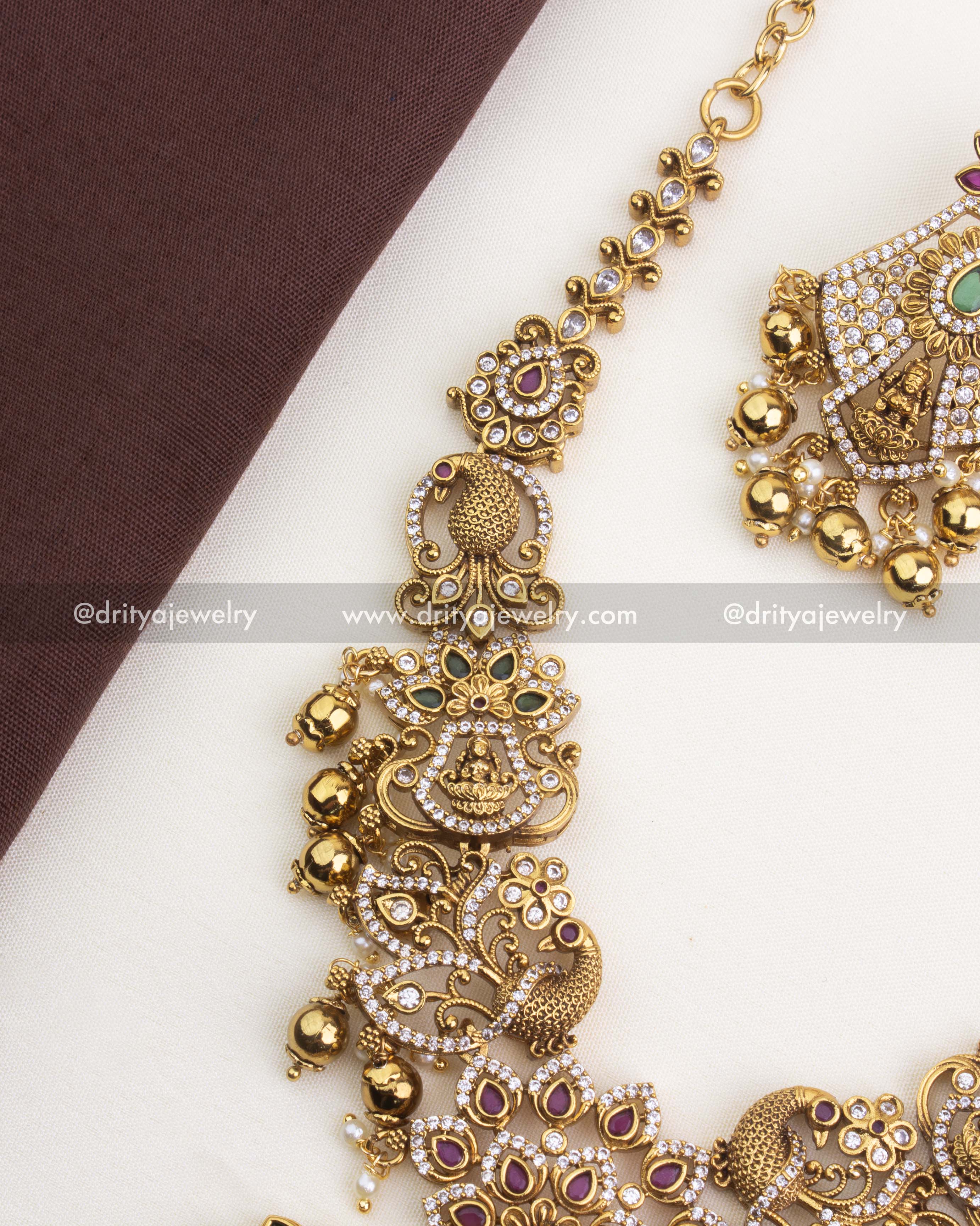 SKU 1252 - Side view of temple necklace link detailing with deity and peacock motifs