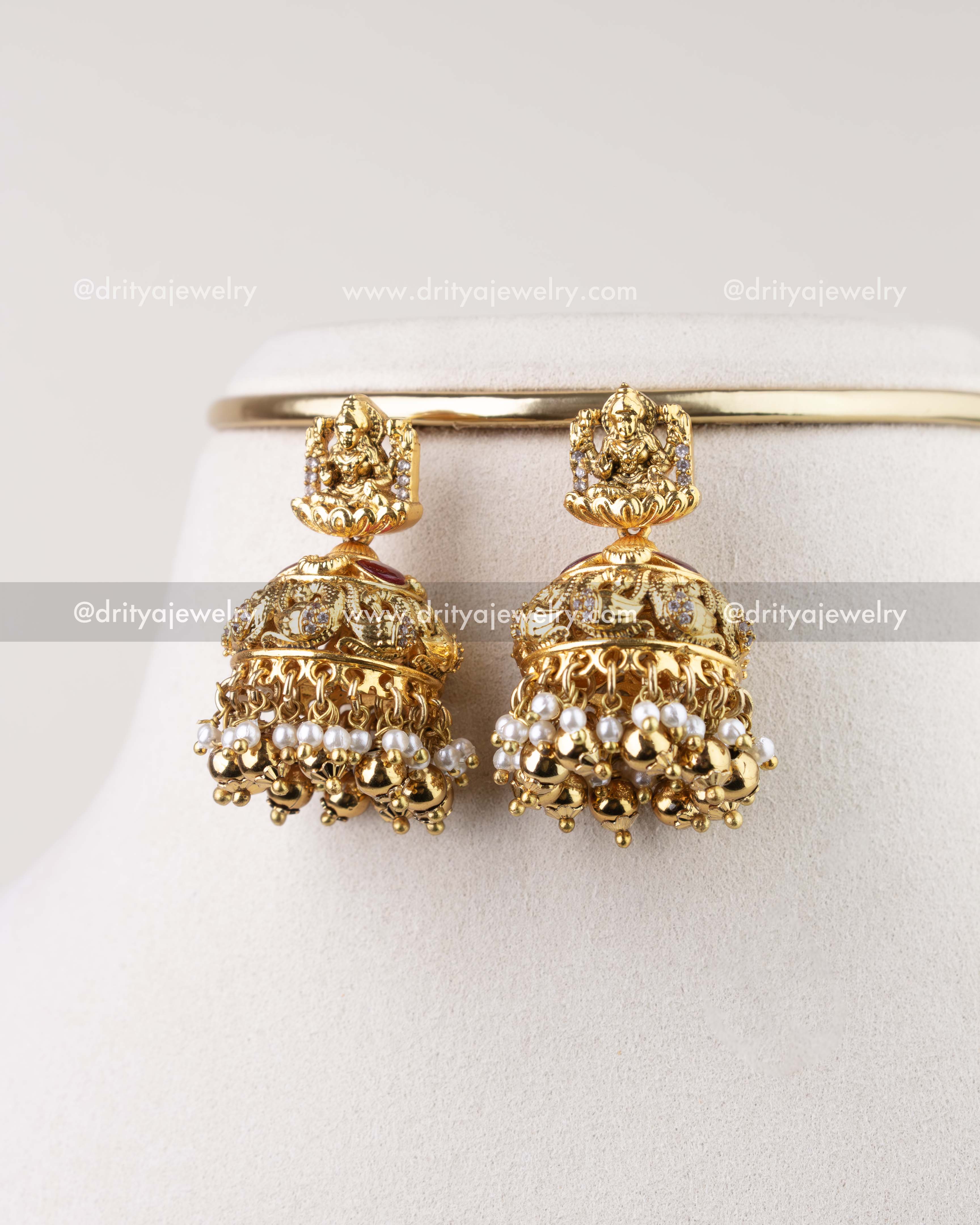 1282 - Close-up of matching antique gold temple jhumka earrings with pearl drops