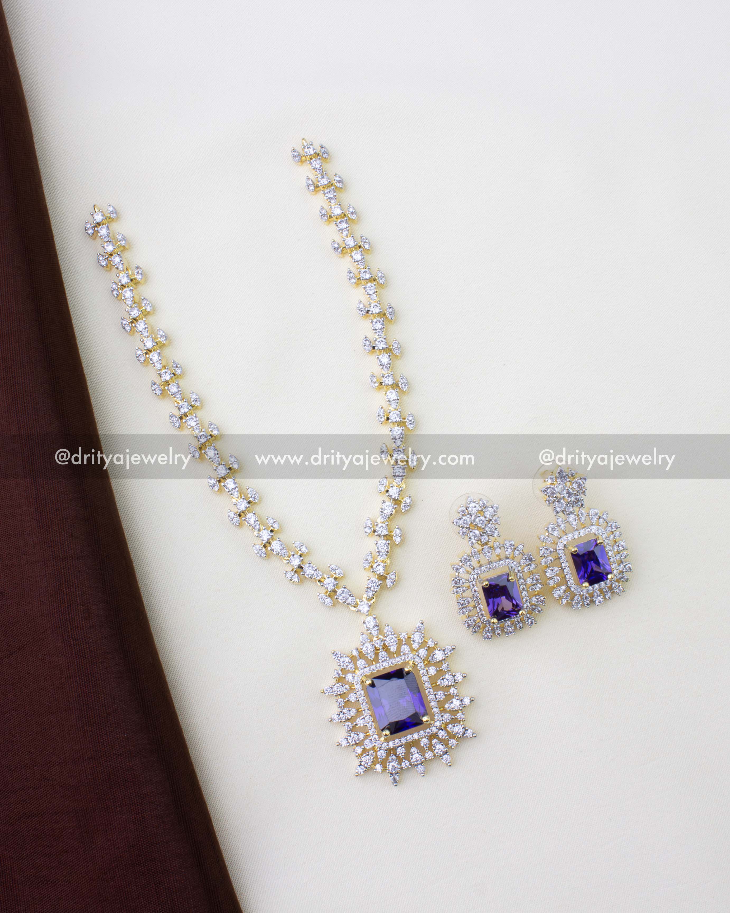 1276-PU full necklace set with short chain and matching earrings laid flat
