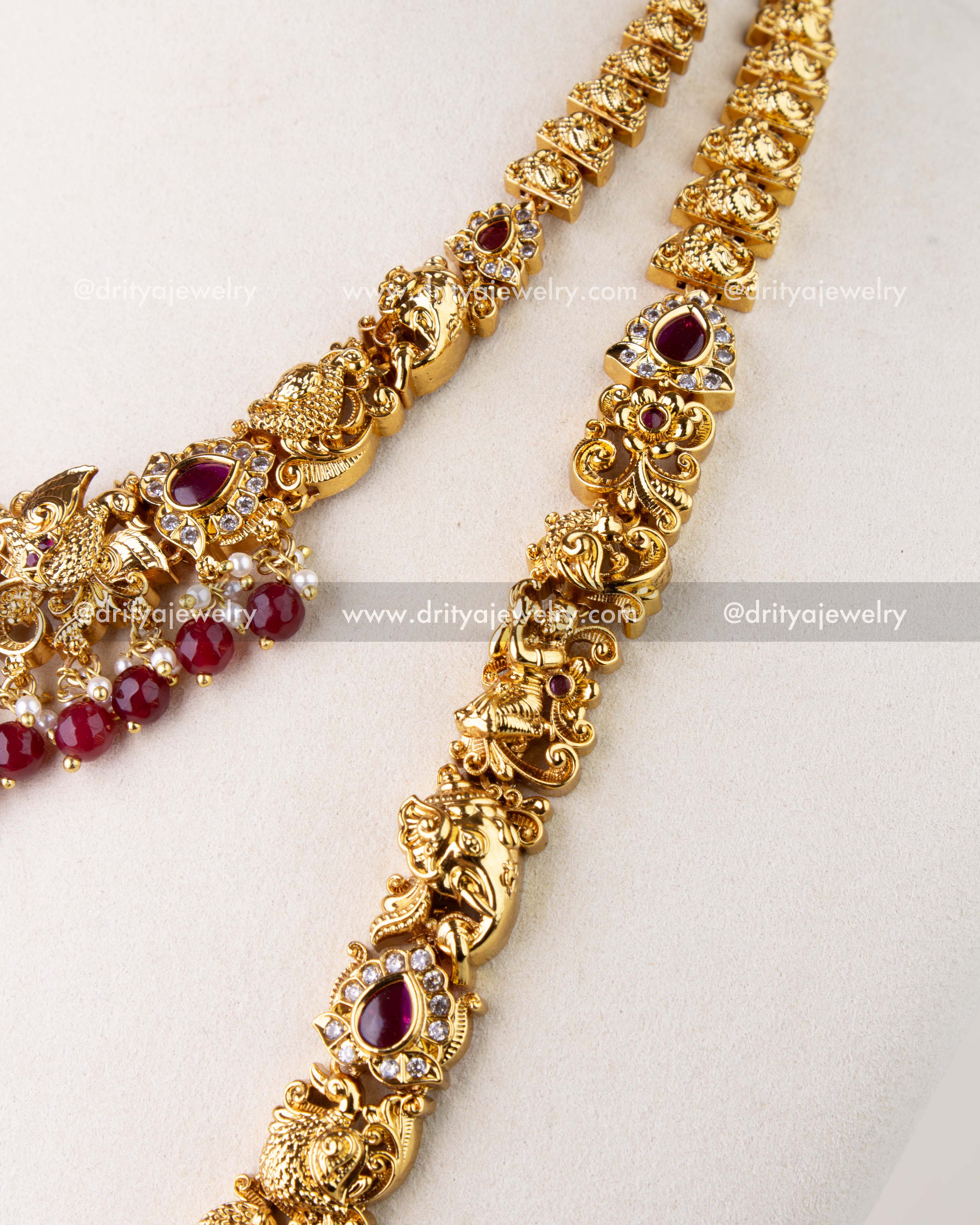 1270-R long necklace side detailing with temple motifs and red stone settings