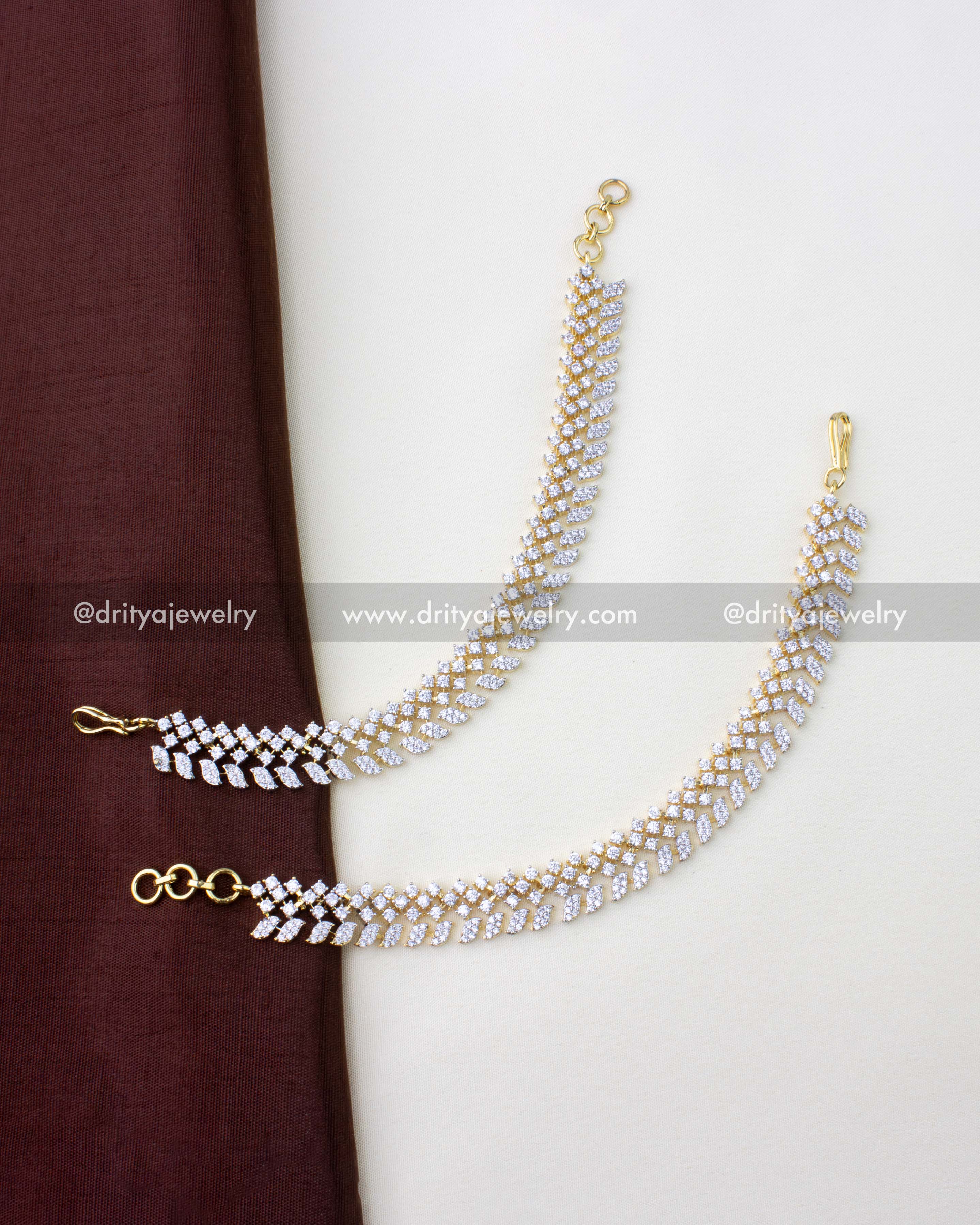 1272 - Pair of diamond replica champaswaralu hair chains laid flat with hooks